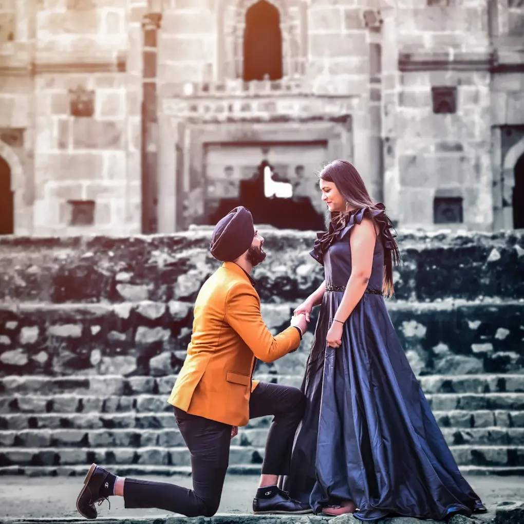Groom kneeling at heritage monument