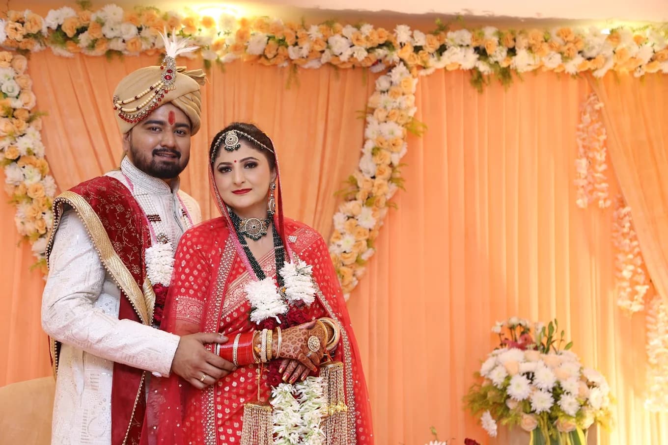Hindu couple at floral mandap