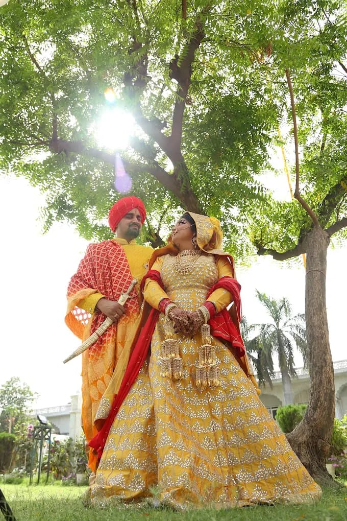 Couple under tree at wedding venue