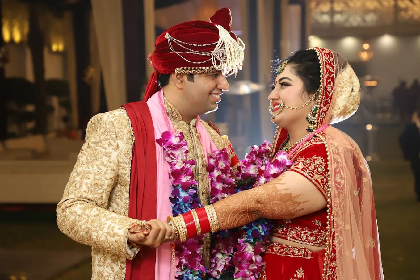 Bride and groom exchanging garlands