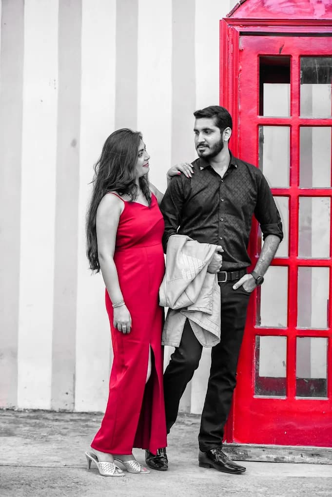 Couple with red phone booth