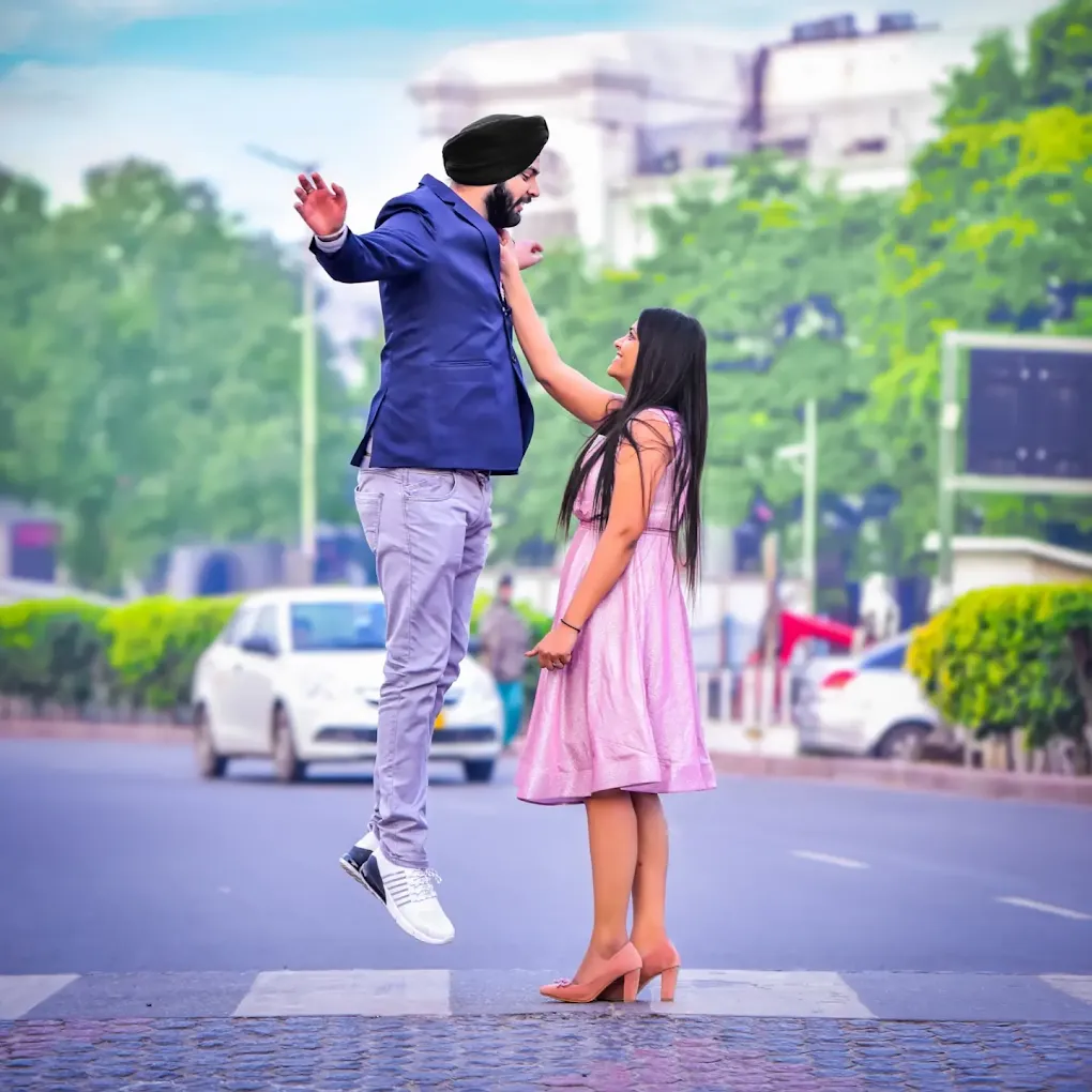 Sikh groom jumping with bride