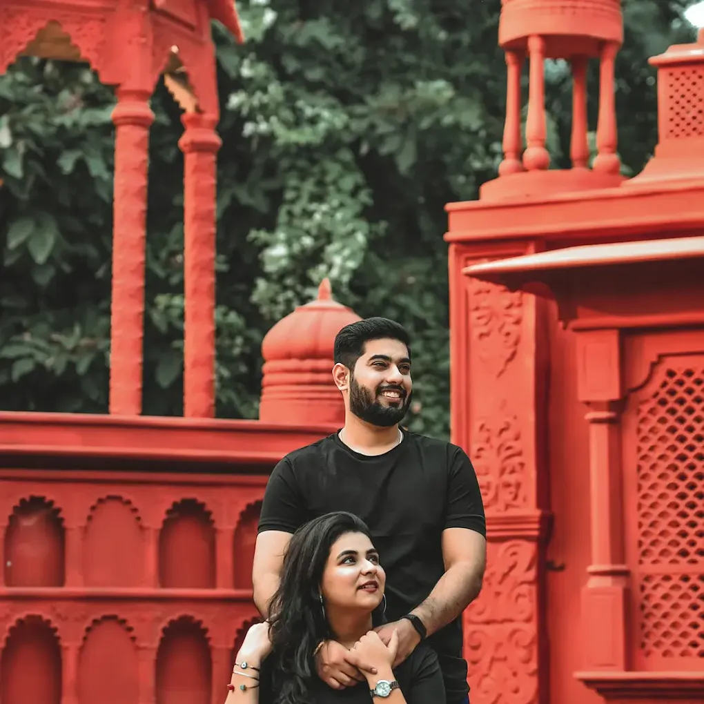 Couple at red Indian heritage structure